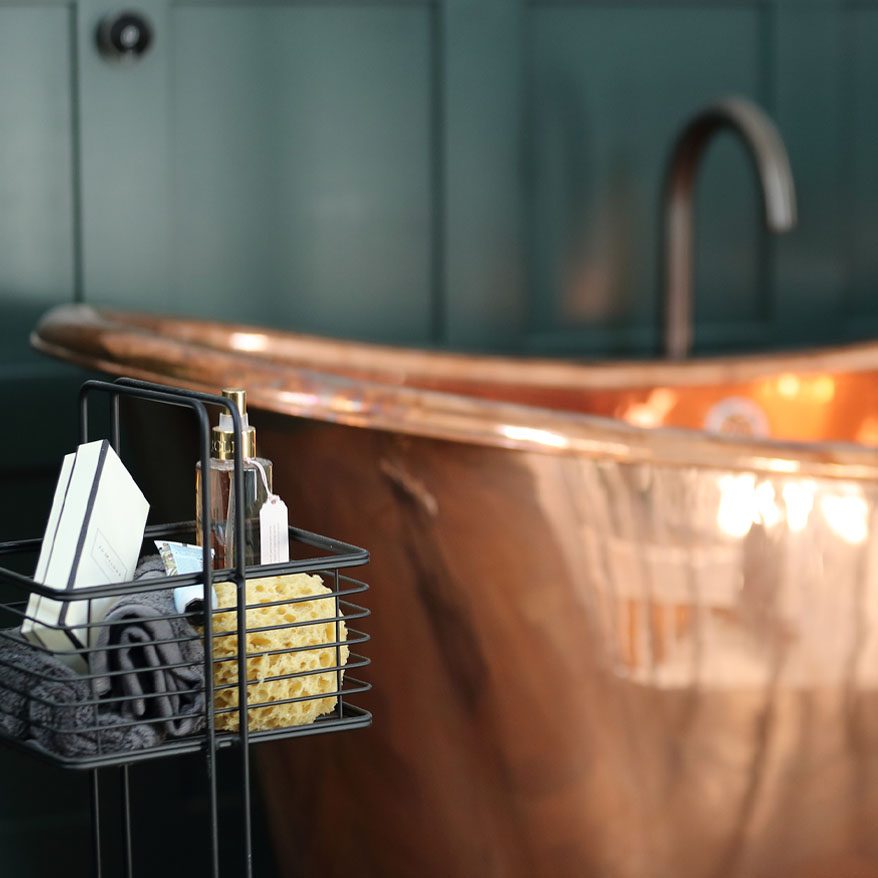 Photo of a copper rolltop bath