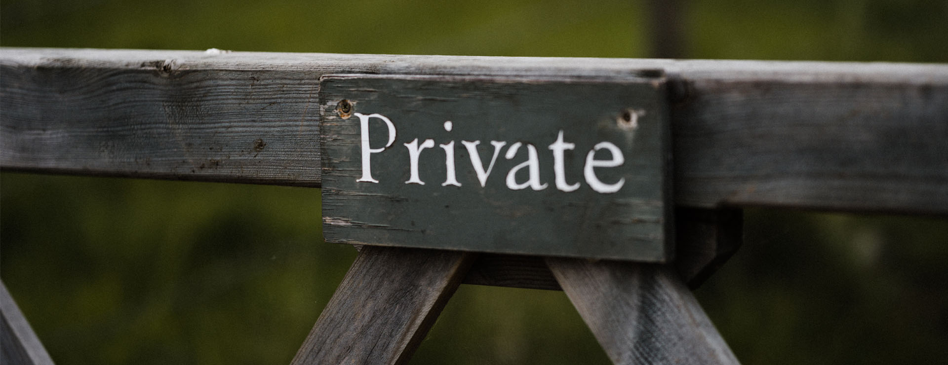 Photo of a gate with a sign saying "Private" on it